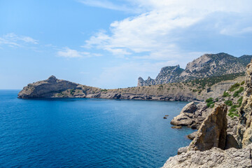 Panorama of cape Kapchik & Blue Bay. From this side shape of rock cape reminds dolphin jumping out of water. Shot near town Novyi Svit, Crimea