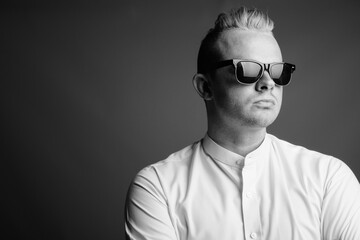 Portrait of businessman with Mohawk hairstyle and blond hair