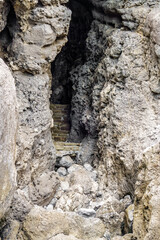 Artificial steps in cave leading outside to light from underground darkness. Shot in Novyi Svit, Crimea