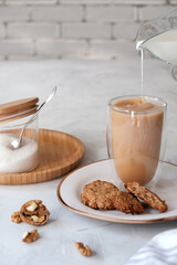 Cosy homemade oatmeal cookies and a cup of coffee.