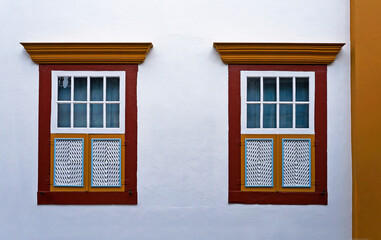 Ancient colonial windows in historical city of Ouro Preto, Brazil