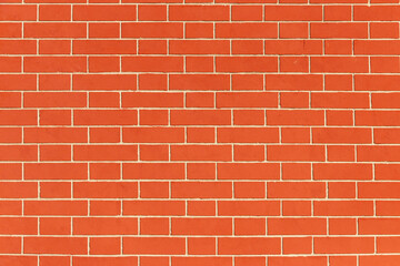 Surface of a red brick wall.