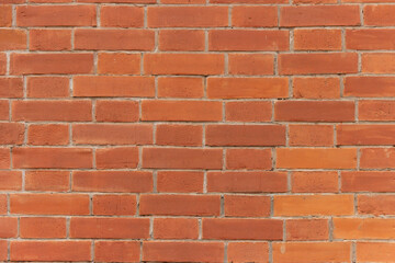 Surface of a red brick wall.