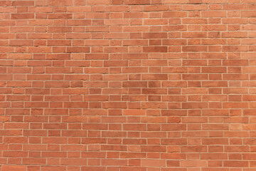 Surface of a red brick wall.