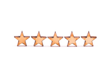 Five wooden stars on white background