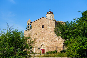 Fototapeta na wymiar Armenian church of Archangels Michael & Gabriel, Feodosia, Crimea. It was built in XIV century. Though structure is traditional, there is influence of medieval Roman architecture