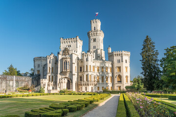 Fototapeta na wymiar Beautiful renaissance castle Hluboka in the Czech Republic is located in south bohemia. Summer wether with blue sky and rose gardens