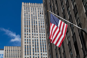 American Flag Outside a Row of Skyscrapers in Midtown Manhattan of New York City