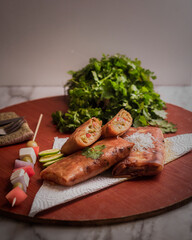 Algerian dish named Bourek very famous also cooked in ramadhan typically filled with meat, cheese or vegetables. It is found in the cuisines of the Turkish cuisine and Balkans