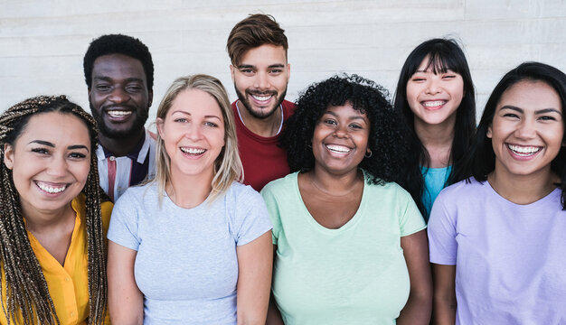 Portrait of young happy multiracial people laughing - Happiness and stop racism concept