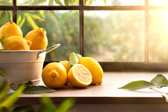 Lemons basket on kitchen with window and orchard outside