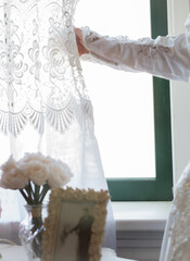 Bride looking out window