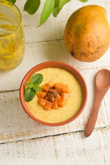 Mango Panna cotta with mango jelly and mint Mithai dessert, mango smoothie juice , refreshment Kerala India. Indian festival sweet food, homemade Mango pudding with pulp, mango puree, cream and sugar 