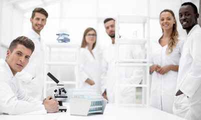 Male Scientist Working With Microscope