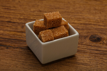 Cane sugar cubs in the bowl