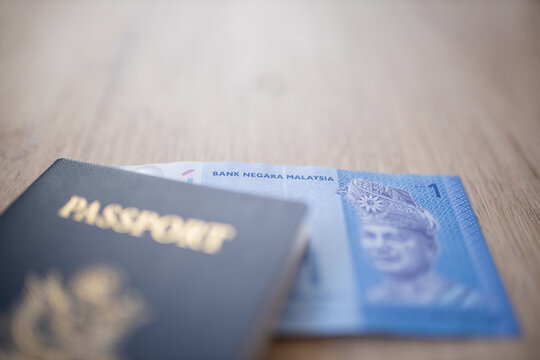 Malaysian National Bank on a One Ringgit Note Inside an American Passport