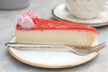 Delicious Natural red with white Cheese cake. Cafe, gray table. Selective focus