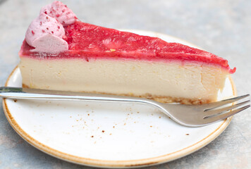 Delicious Natural red with white Cheese cake. Cafe, gray table. Selective focus