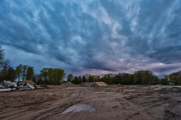 Cloudy industrial view of construction site with sand.