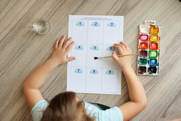 Montessori material. Children's hands. The study of mathematics and seasons. School and kindergarten. early development of children. preparation for school