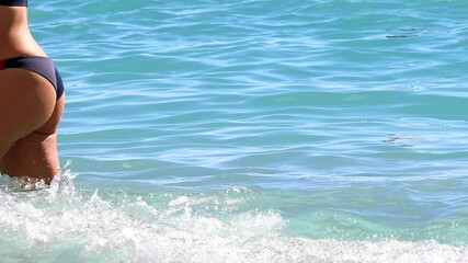 Woman In Tanga Bikini At Beach