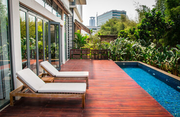 Beach Bench besides the pool