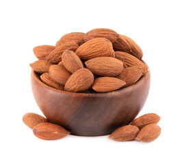 Almonds nuts in wooden bowl, isolated on white background. Pile of fried almond nuts. Top view.