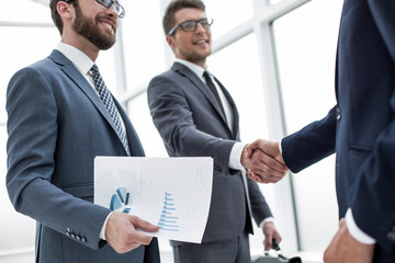 Fototapeta premium financial partners shaking hands