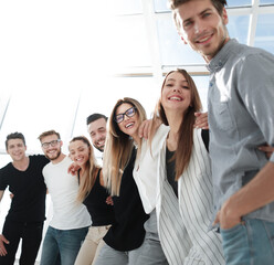 smiling business team standing in the new office.