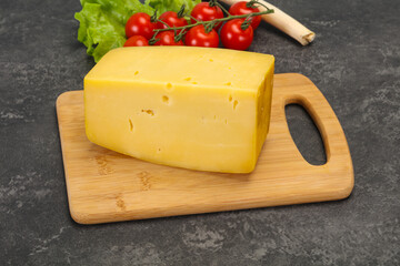 Hard yellow tasty cheese brick