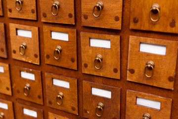 A photo of some little wooden drawers in square form