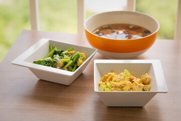 Omelet stir with bitter gound and garlic with stir fried vegetable and mushroom soup