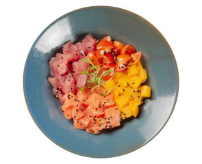 Salmon, tuna, tomato and mango poke on a blue bowl isolated over white background