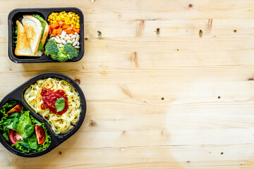Delivery containers with takeout food on table. View from above