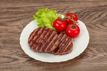 Grilled burger cutlet with sauce