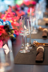 Naklejka na ściany i meble empty wine glasses set up on vibrant flower decor table