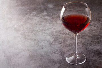 a glass of red wine and a place for the text.