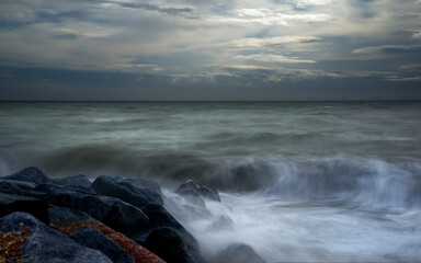 waves hitting rock long exposure