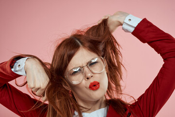 Elegant woman wearing glasses red lips jacket long hair pink
