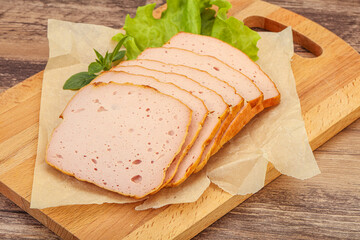 Boiled pork sausage over board