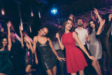 Nice attractive elegant cheerful crowd dancing enjoying rest relax festal corporate event evening social life in dark night club indoors