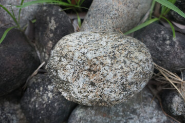 plutonic granite rock on nature background. Granite, coarse- or medium-grained intrusive igneous rock that is rich in quartz and feldspar