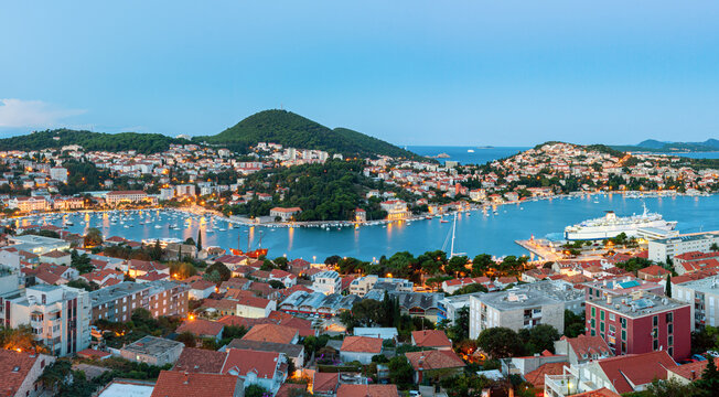 View of Gruz neighborhood and the lapad peninsular of Dubrovnik during sunrise with the Adriatic sea in the background. Croatia.