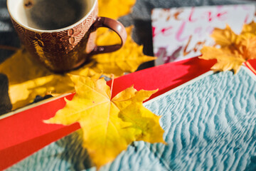 cup of coffee and autumn leaves
