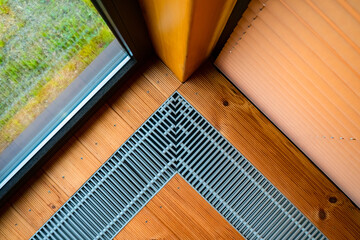 Heating in the floor of the cottage. Ventilation grilles in the floor. Maintaining a favorable...