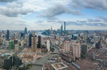 Fototapeta premium Aerial view of the skyscrapers in Shanghai, China, on a cloudy day.