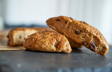 Traditional fresh baked English homemade scones with raisins for breakfast.   