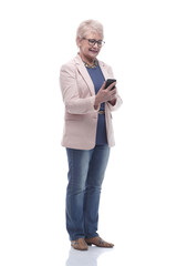 in full growth. senior woman is reading a conversation on her smartphone