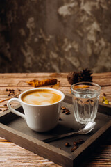 Cappuccino or Coffee with milk cup and roasted beans. Coffee background