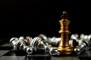 Golden King chess is last standing in the chess board, Concept of successful business leadership